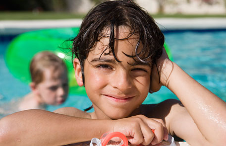 image of little boy at the swimming pool